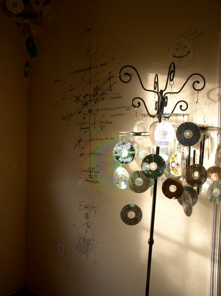 Music CDs reflecting light onto a wall