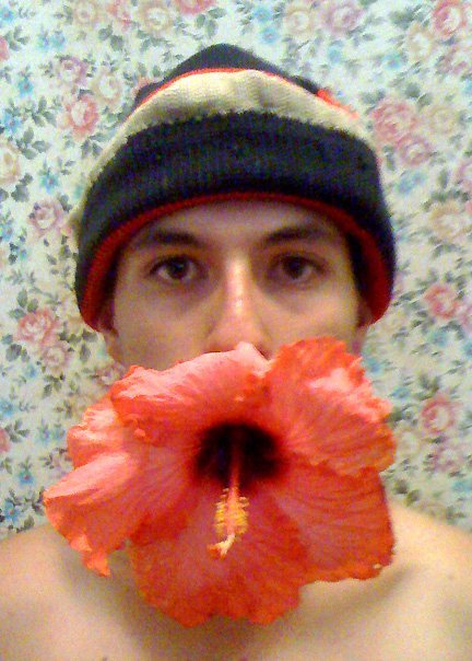 Boy with flower in mouth